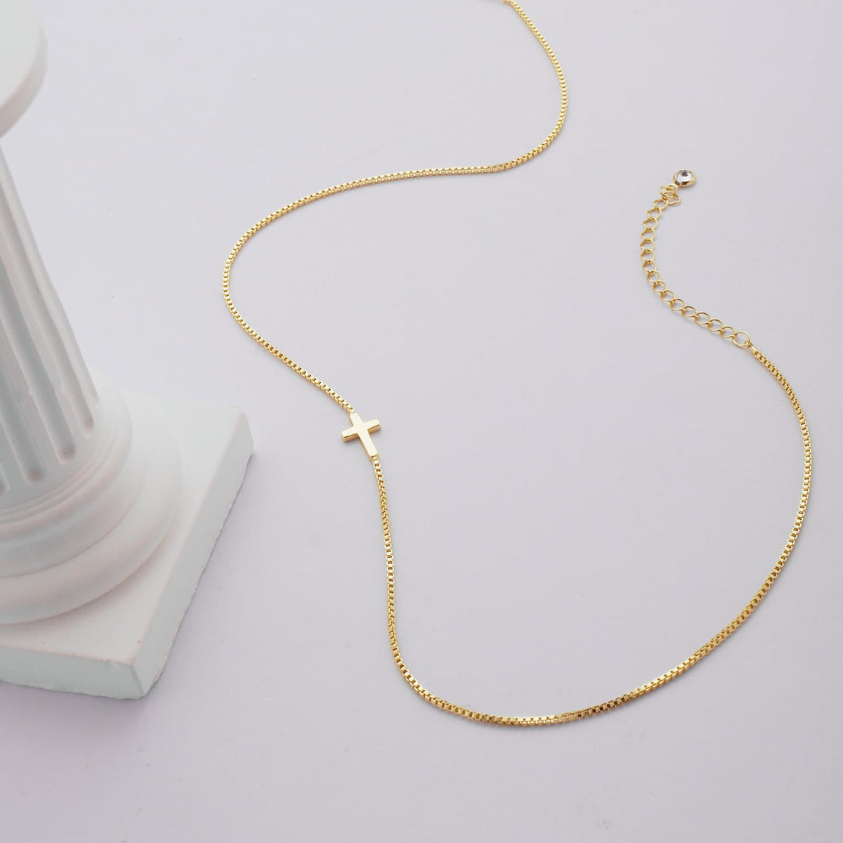 Holding Cross necklace