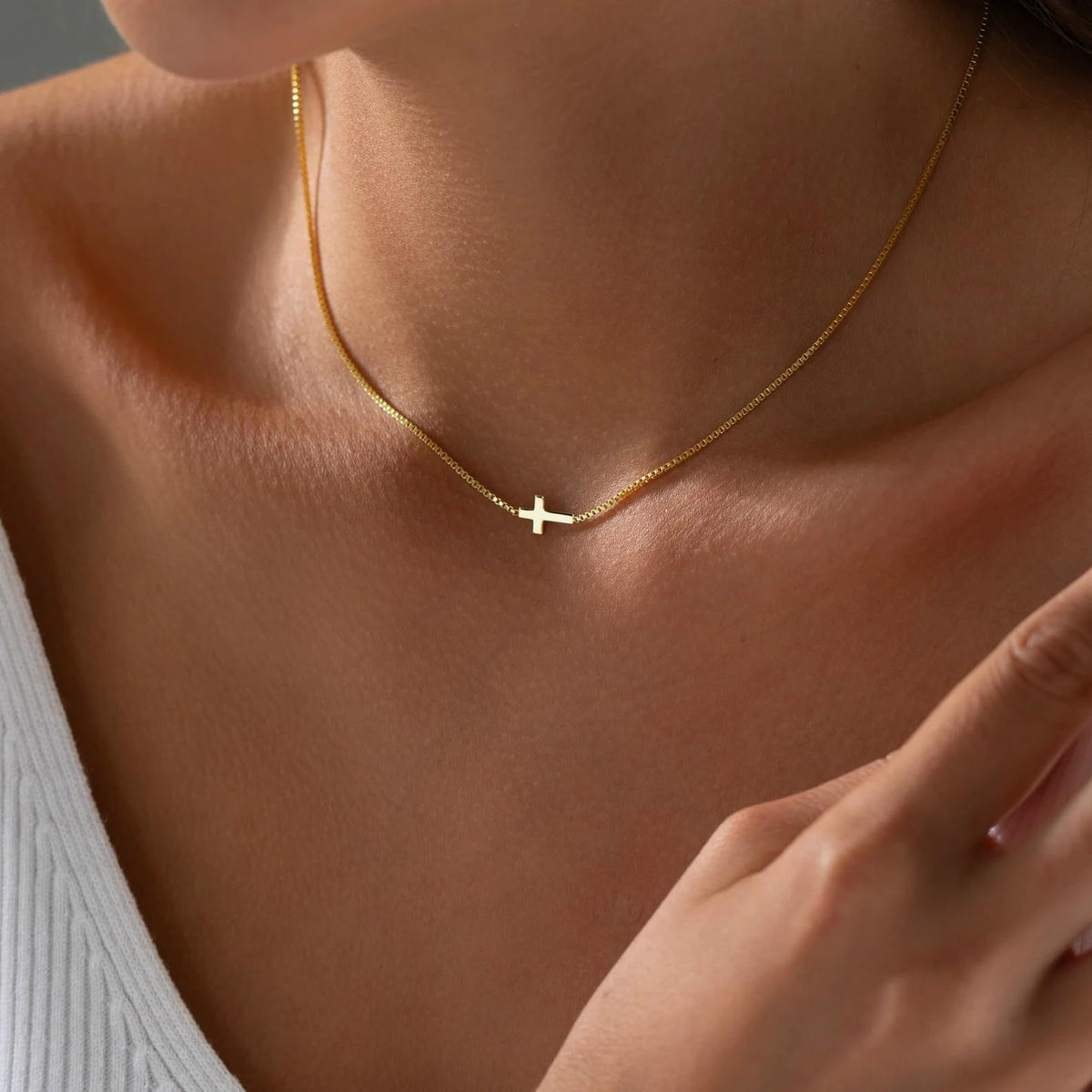 Holding Cross necklace